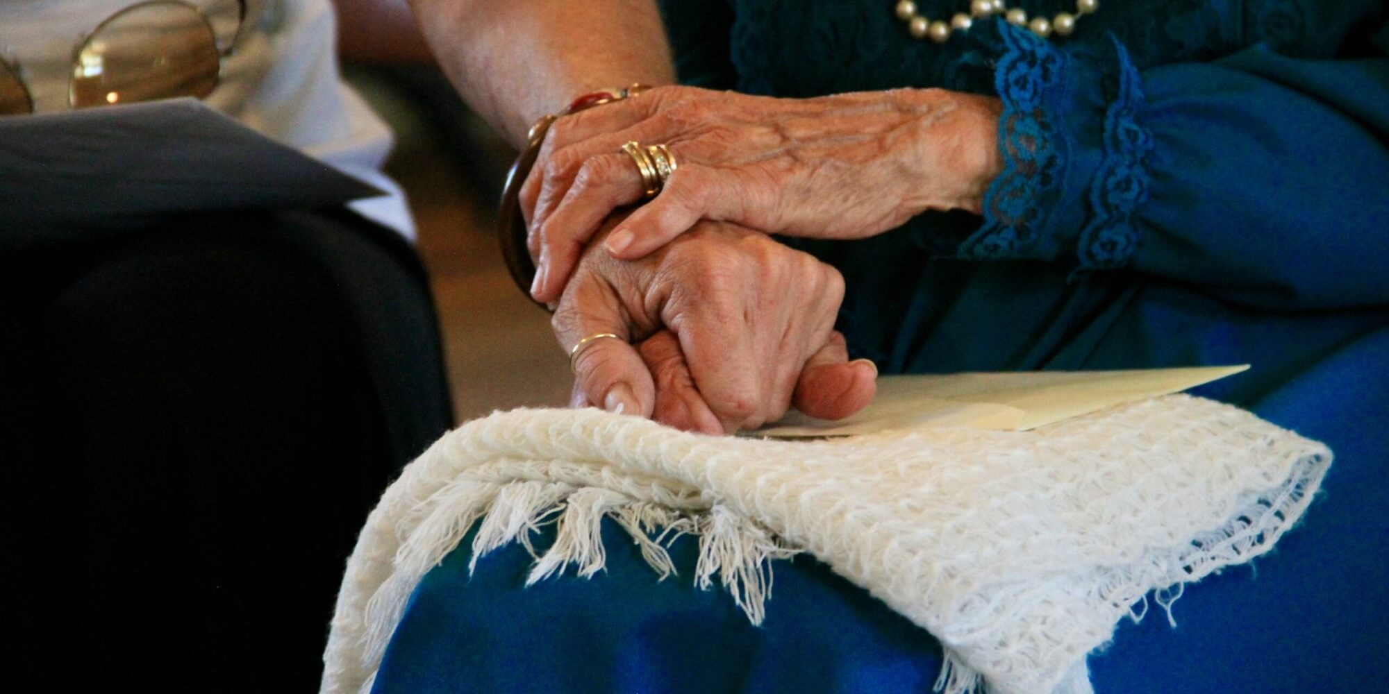 Senior Aging at Home Senior and caregiver holding hands