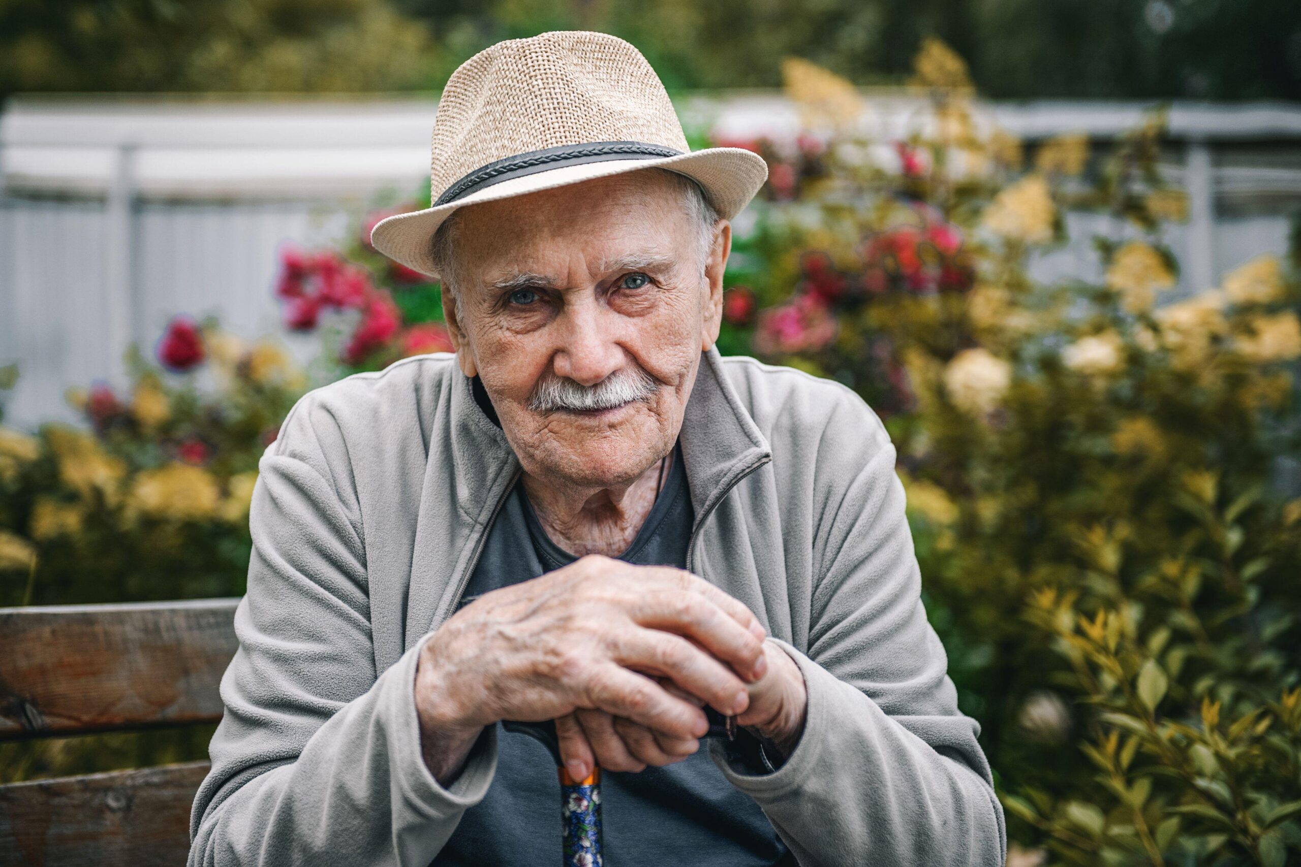 Portrait of a smiling and confident older 87-year-old handsome man in a hat with a mustache. Happy active old age. Portrait of a man in the autumn Portrait of a smiling and confident older 87-year-old handsome man in a hat with a mustache. Happy active old age. Portrait of a man in the autumn
